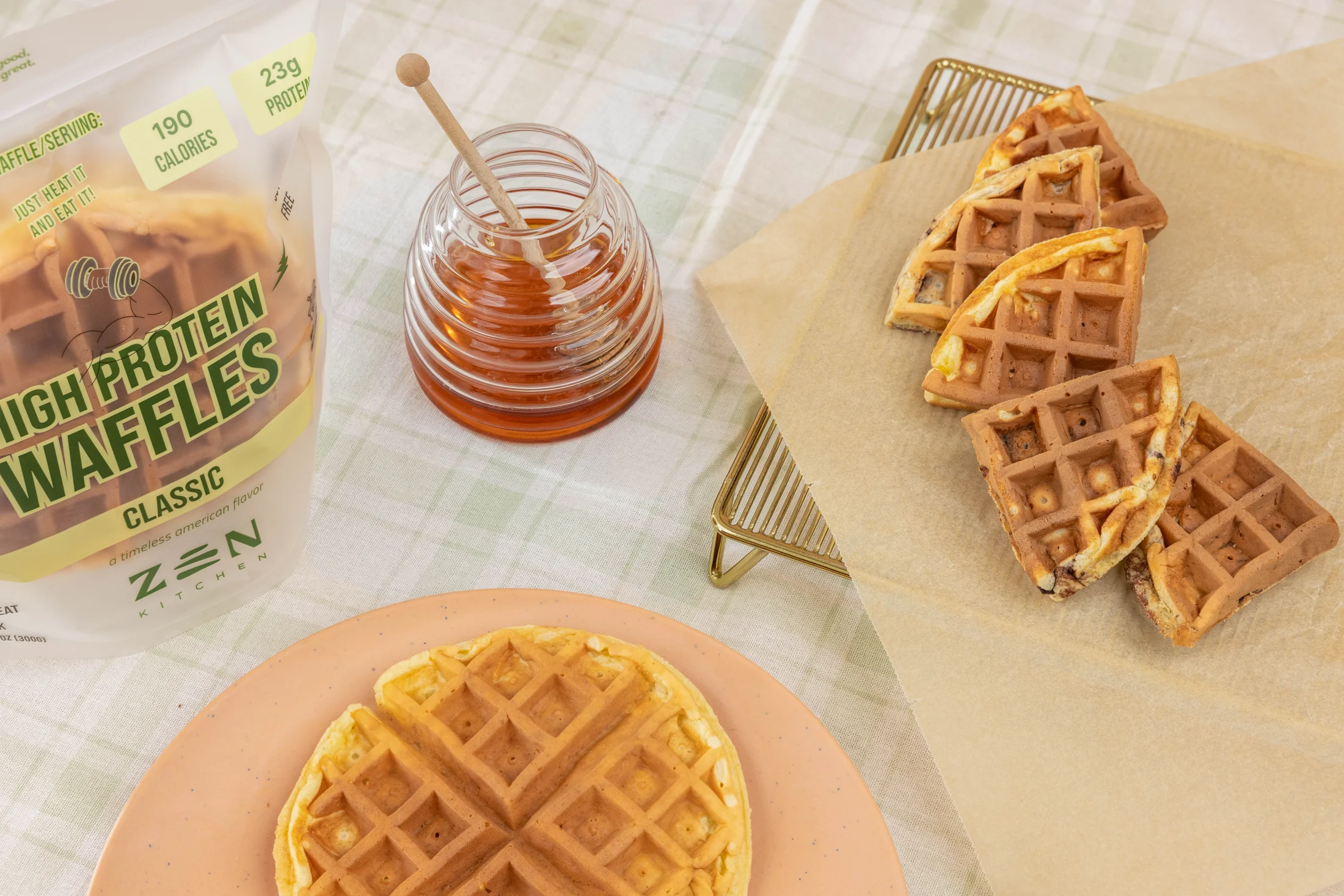 Golden protein waffles, honey and the Zen Classic pack on a sunlit breakfast table